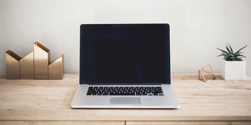 Business owner reviewing their website on a laptop
